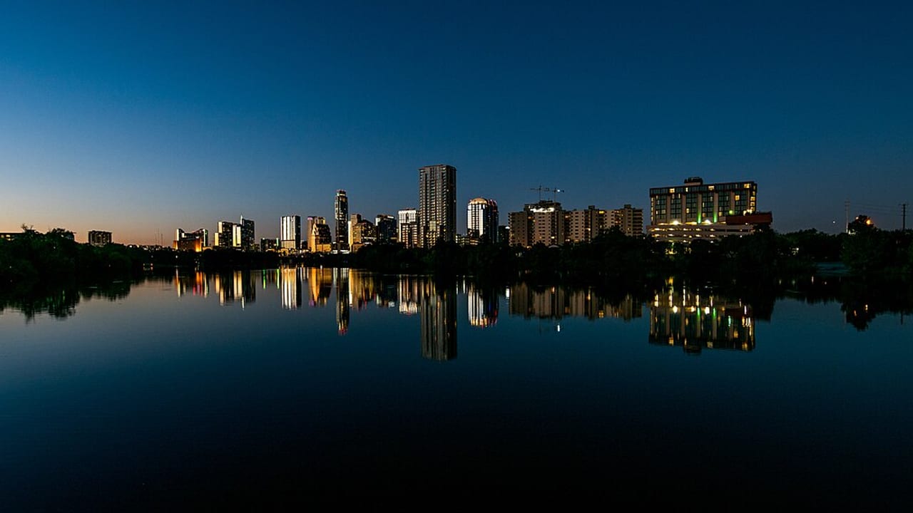 Austin skyline at dusk, reflected in Lady Bird Lake