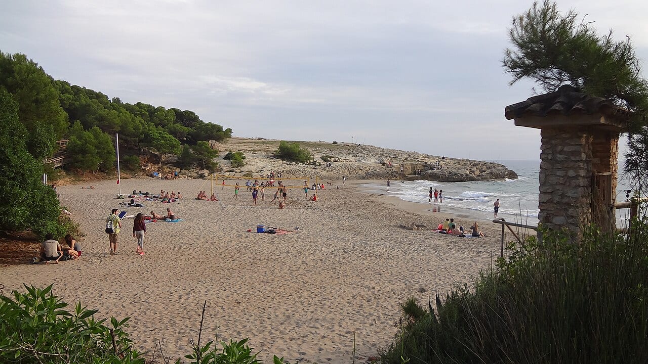 Mediterranean cove beach with stone watchtower