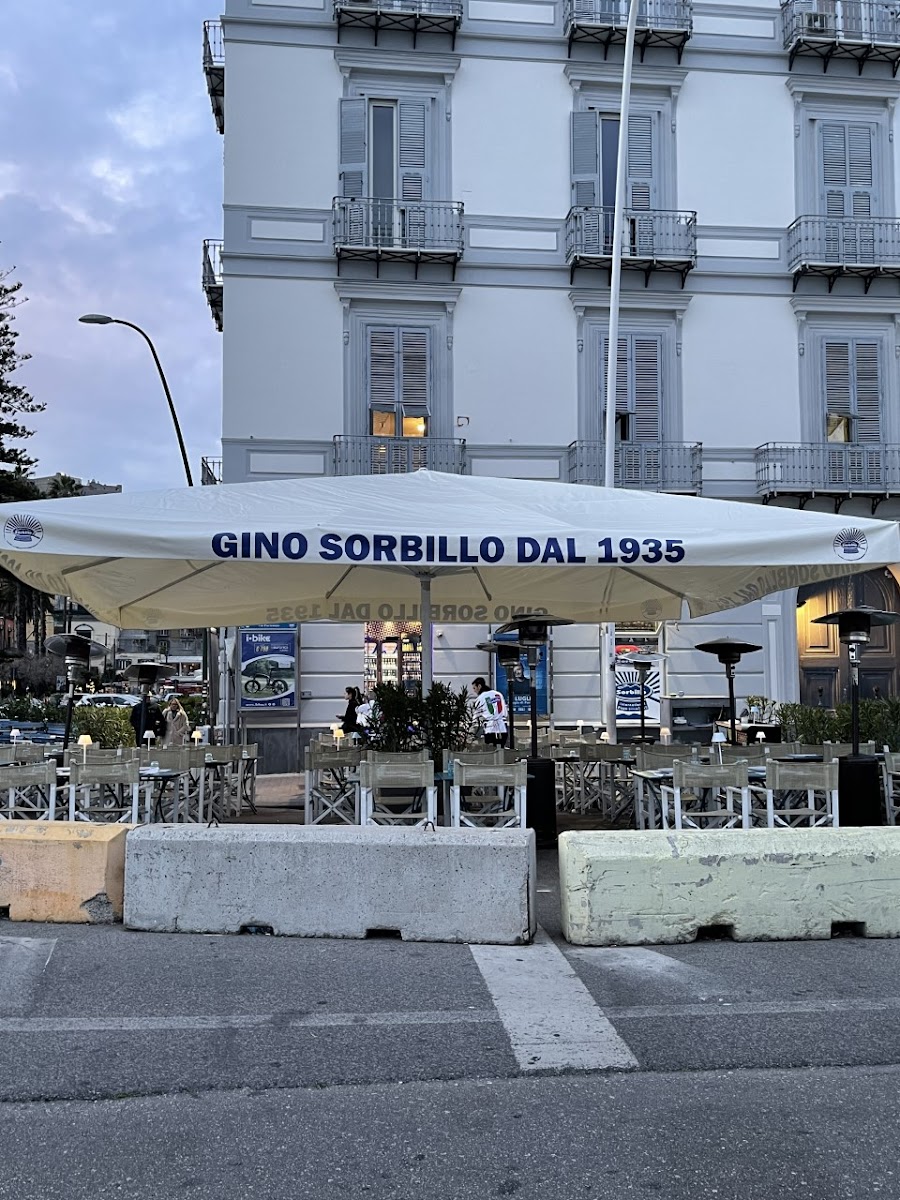 Gino Sorbillo Lievito Madre al Mare outdoor seating on the Naples waterfront.